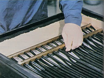 Bottom right: SolaRoll's 36 fluid-carrying passages are sealed to the headers by pressing the rubber tubes—with Teflon jam sleeves inside—into preformed openings.